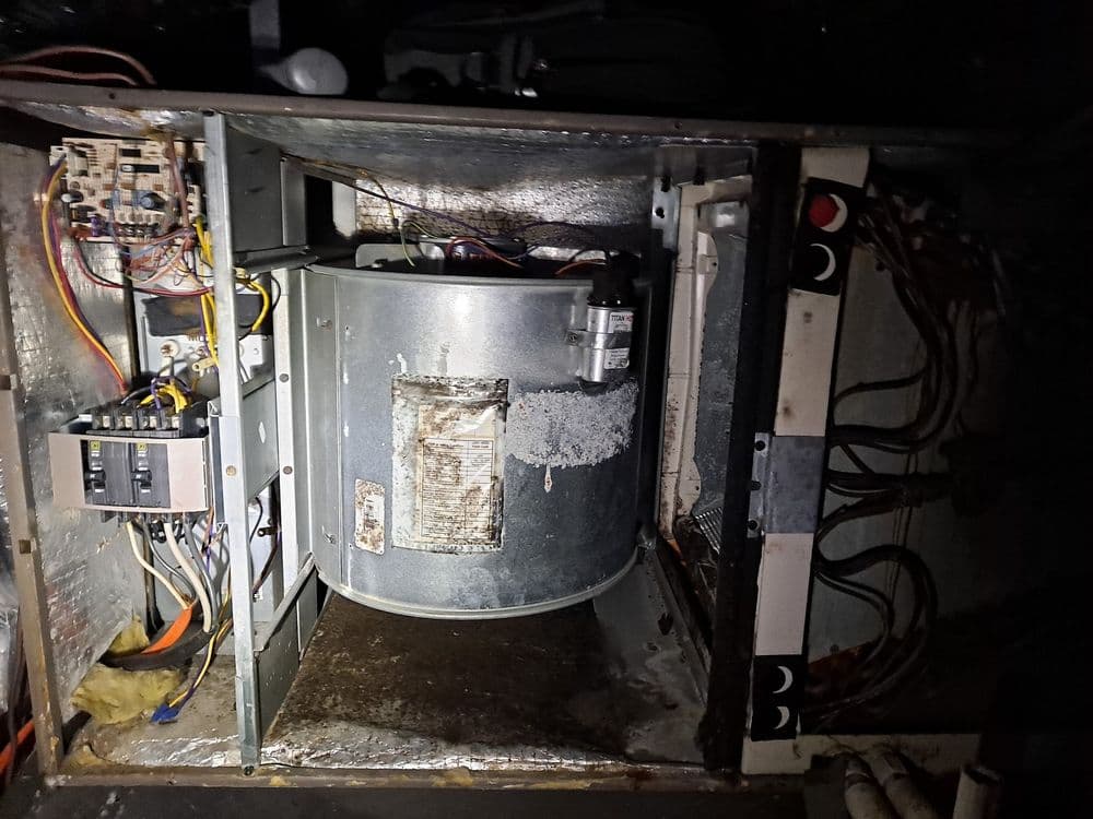 Interior view of an HVAC unit with visible components and electrical wiring.